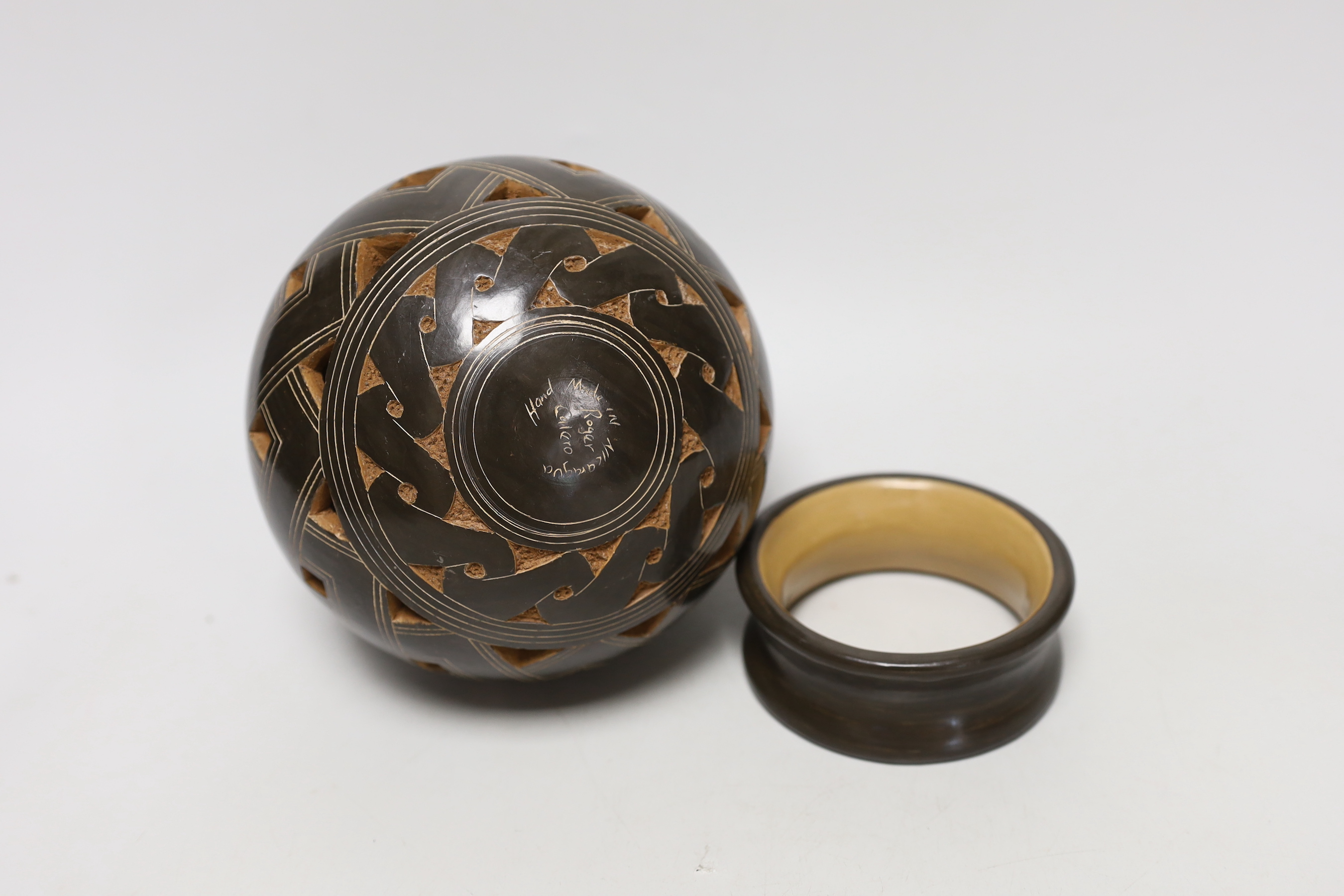 A Nicaraguan studio pottery vase and matching stand, signed on base of vase Roger Calero, 17cm high including stand